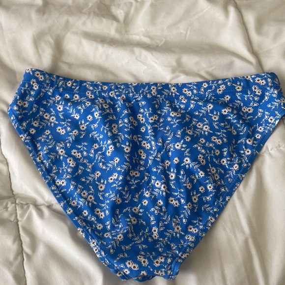 A medium size blue swimsuit with floral design. - Picture 6 of 7